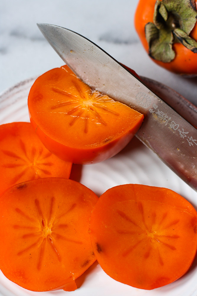 Persimmons being sliced-9873